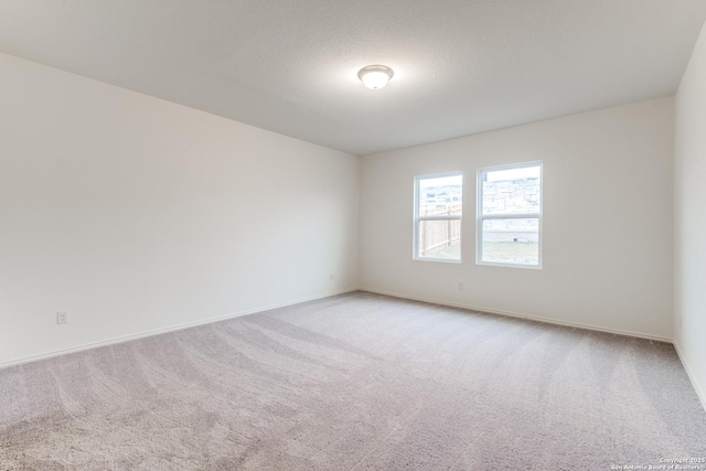 5014 Jovian, San Antonio, TX 78245 - unfurnished room with baseboards and light colored carpet