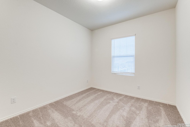 5014 Jovian, San Antonio, TX 78245 - empty room featuring baseboards and carpet flooring