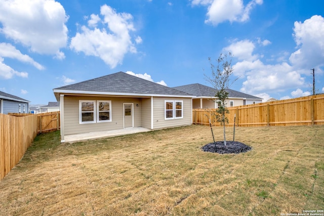 5014 Jovian, San Antonio, TX 78245 - rear view of property with a lawn, roof with shingles, a fenced backyard, and a patio area