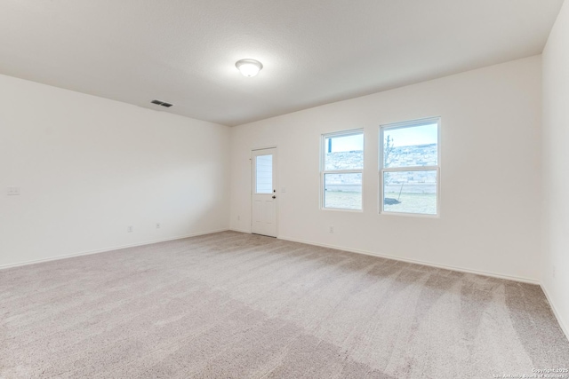 5014 Jovian, San Antonio, TX 78245 - unfurnished room with baseboards, visible vents, and light carpet