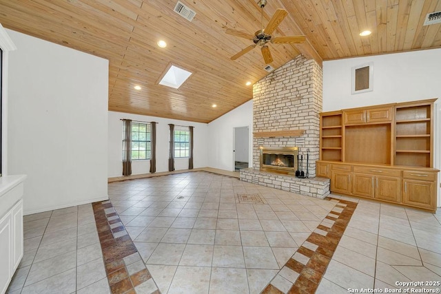 unfurnished living room with a ceiling fan, light tile patterned floors, and wooden ceiling