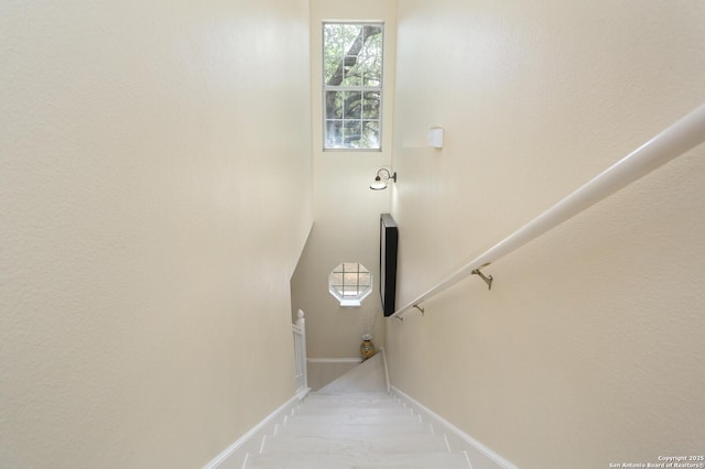 stairs featuring baseboards