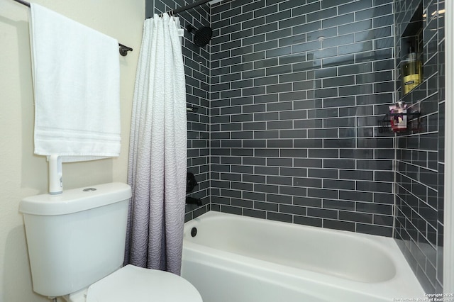 bathroom featuring toilet and shower / bath combo with shower curtain