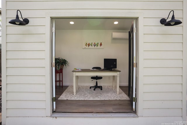 view of exterior entry featuring an AC wall unit