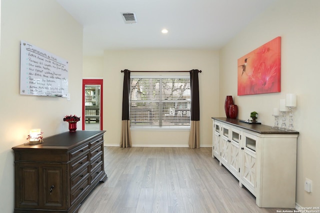 doorway to outside with visible vents, recessed lighting, baseboards, and light wood-type flooring