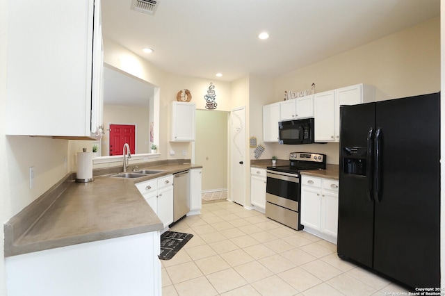 kitchen with visible vents, white cabinets, a sink, light tile patterned floors, and black appliances