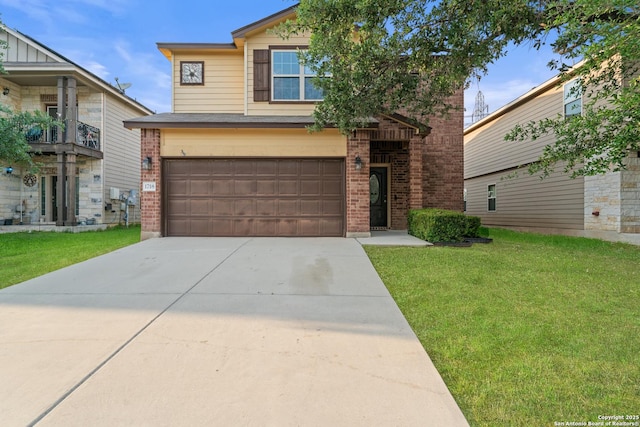 view of front of property featuring an attached garage, a front yard, driveway, and brick siding
