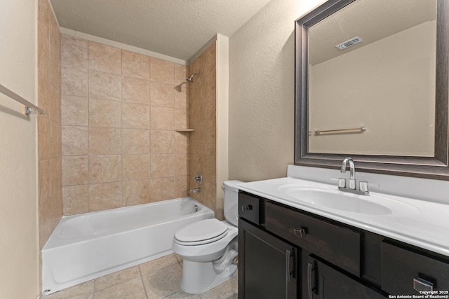 full bathroom with visible vents, vanity, toilet, a textured ceiling, and shower / washtub combination
