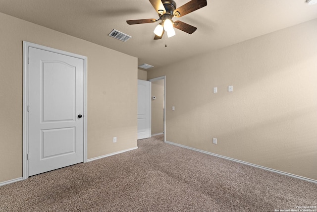 unfurnished bedroom with carpet floors, a ceiling fan, baseboards, and visible vents