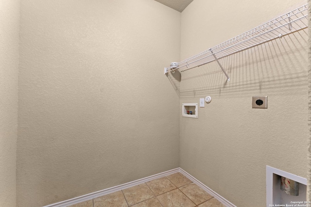 laundry room with laundry area, baseboards, electric dryer hookup, washer hookup, and hookup for a gas dryer