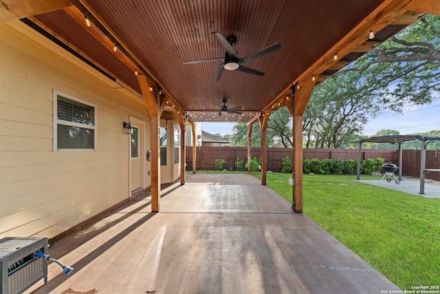 view of patio / terrace featuring a fenced backyard and a ceiling fan