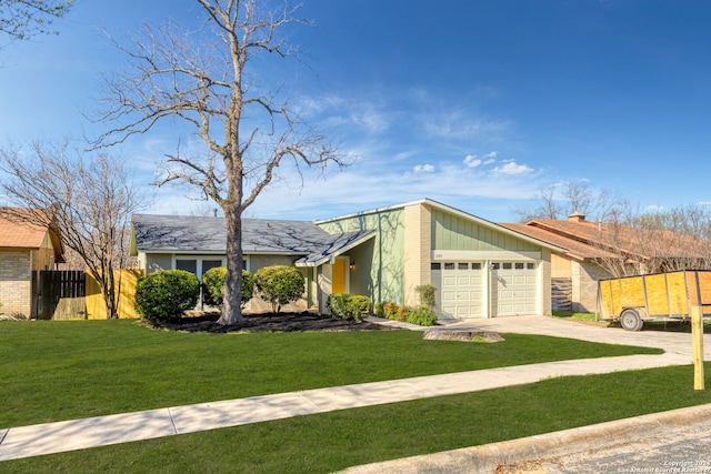 12831 Tarrytown, San Antonio, TX 78233 - mid-century inspired home with concrete driveway, fence, a front lawn, and a garage