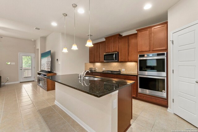 205 Wickersham, Boerne, TX 78015 - kitchen with a sink, stainless steel appliances, light tile patterned floors, tasteful backsplash, and visible vents