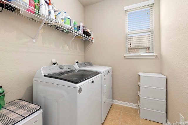 205 Wickersham, Boerne, TX 78015 - washroom featuring laundry area, baseboards, light tile patterned floors, and separate washer and dryer