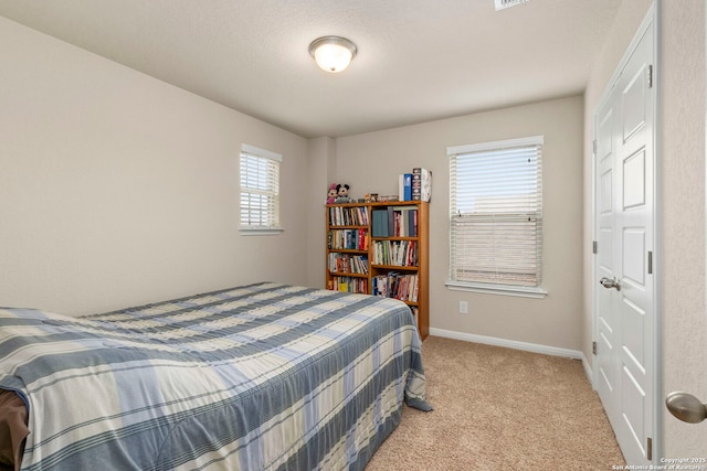 205 Wickersham, Boerne, TX 78015 - bedroom featuring baseboards and light carpet