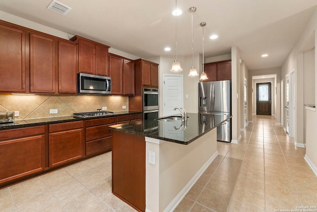 205 Wickersham, Boerne, TX 78015 - kitchen with light tile patterned flooring, appliances with stainless steel finishes, a sink, backsplash, and visible vents