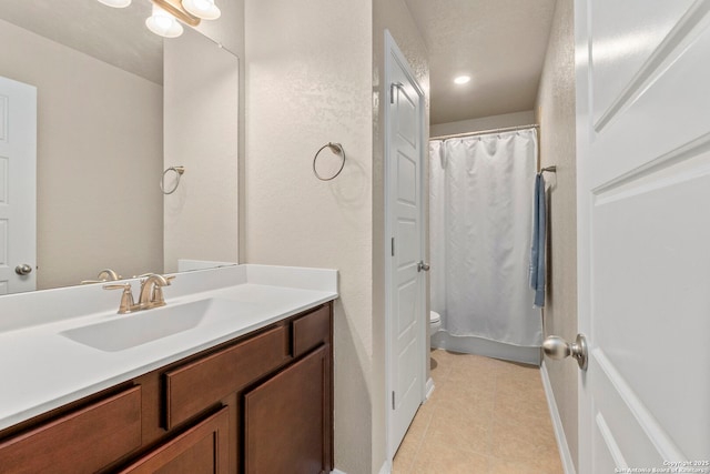 205 Wickersham, Boerne, TX 78015 - full bathroom featuring toilet, tile patterned flooring, and vanity