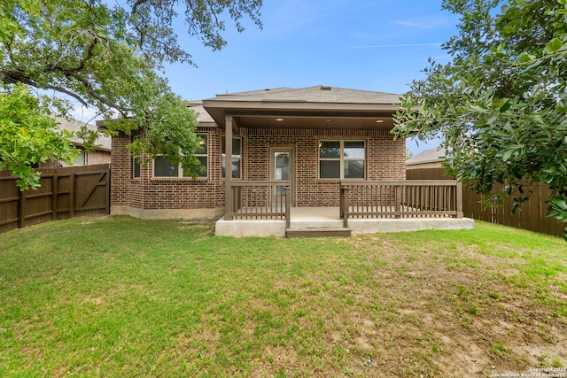 205 Wickersham, Boerne, TX 78015 - rear view of house featuring a fenced backyard, a patio, and a yard