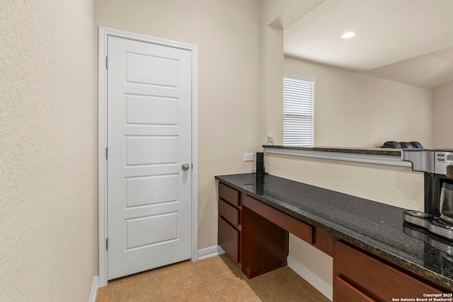 205 Wickersham, Boerne, TX 78015 - interior space with light tile patterned flooring, baseboards, a textured wall, and built in study area