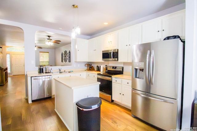 5315 Argyle, San Antonio, TX 78247 - kitchen featuring ceiling fan, light wood-type flooring, light countertops, white cabinetry, and stainless steel appliances