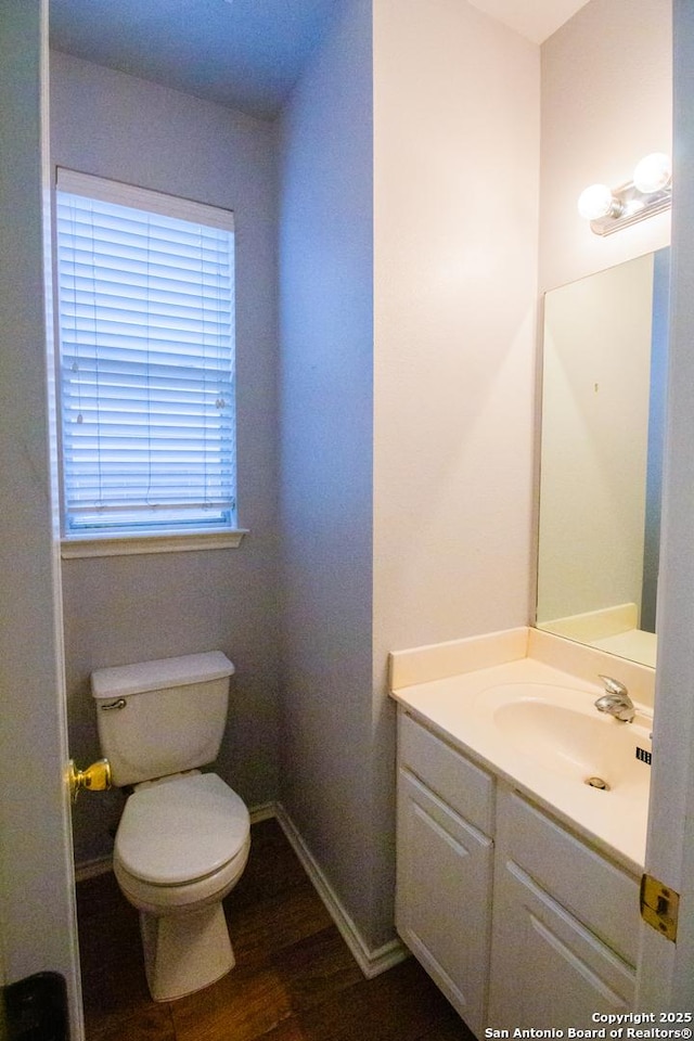 5315 Argyle, San Antonio, TX 78247 - bathroom featuring vanity, baseboards, toilet, and wood finished floors