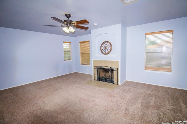 5315 Argyle, San Antonio, TX 78247 - unfurnished living room featuring a fireplace, carpet, a ceiling fan, and a wealth of natural light