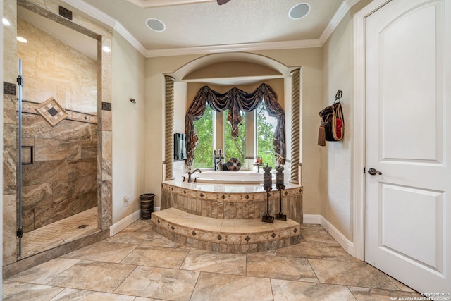 full bathroom featuring baseboards, ornamental molding, a garden tub, and a stall shower