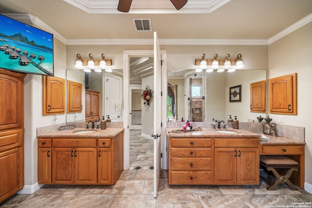 full bath with a sink, crown molding, ceiling fan, and visible vents