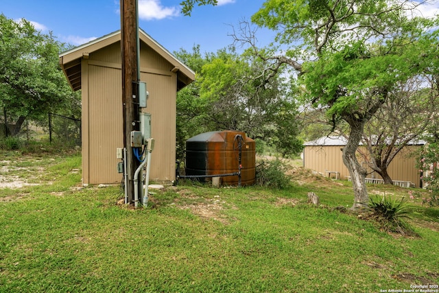 view of shed featuring fence