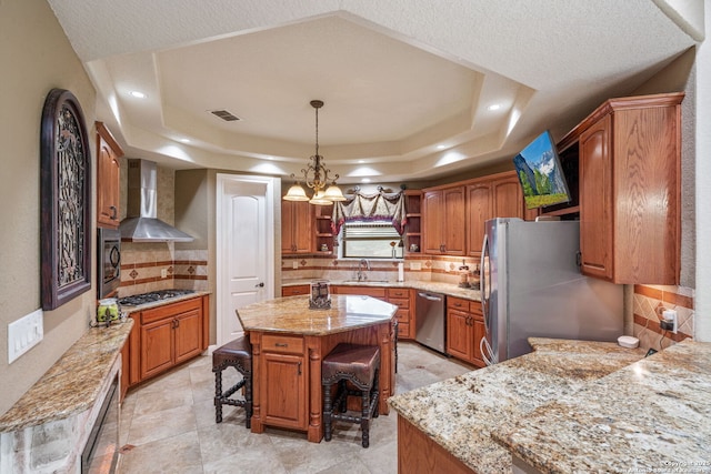 kitchen with open shelves, decorative backsplash, wall chimney range hood, a sink, and stainless steel appliances