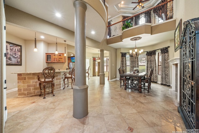 dining area with recessed lighting, decorative columns, a healthy amount of sunlight, and ceiling fan with notable chandelier