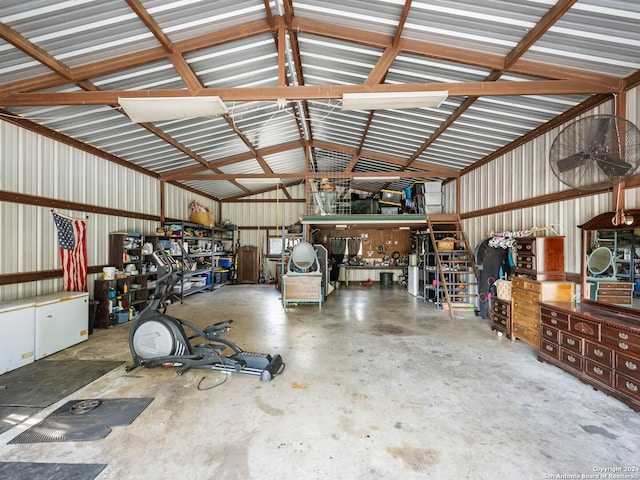 garage featuring a workshop area and metal wall
