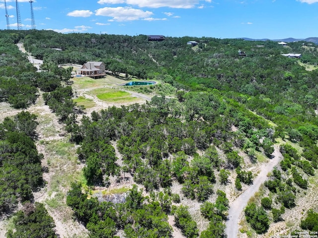 aerial view featuring a view of trees