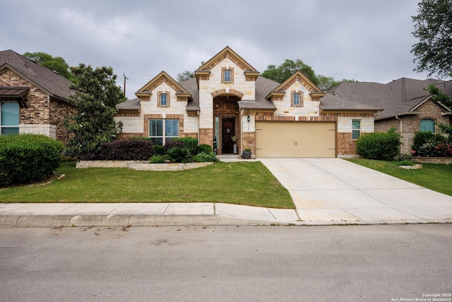 french provincial home with an attached garage, a front yard, driveway, and stone siding