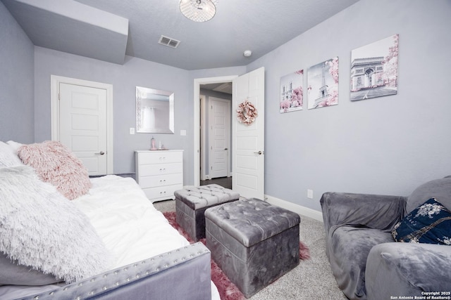 carpeted living room with visible vents and baseboards