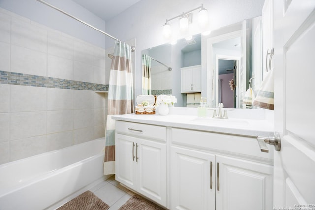 bathroom with shower / bathtub combination with curtain, tile patterned flooring, and vanity