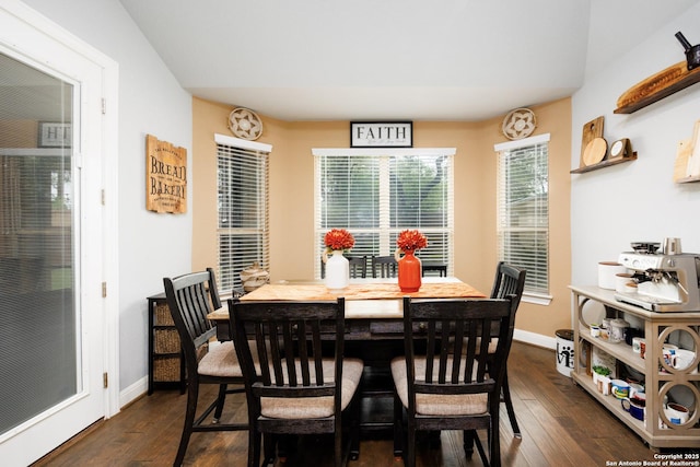 dining space with baseboards and dark wood-style floors