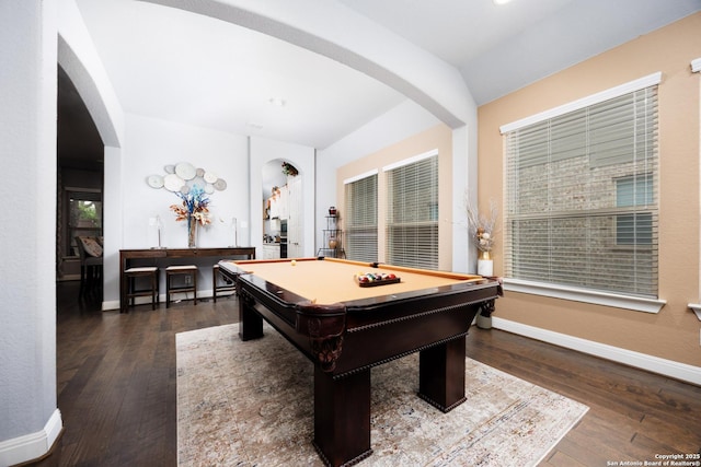 rec room with arched walkways, baseboards, and hardwood / wood-style floors