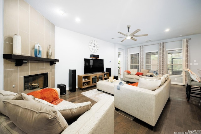 living room with recessed lighting, ceiling fan, dark wood-style floors, and a fireplace
