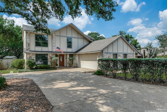 19750 Encino Way, San Antonio, TX 78259 - tudor-style house featuring stone siding, a garage, driveway, and board and batten siding