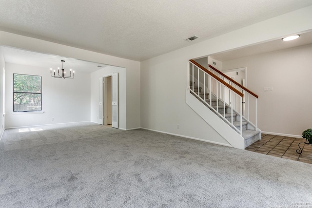 19750 Encino Way, San Antonio, TX 78259 - unfurnished living room featuring carpet flooring, a chandelier, stairs, baseboards, and a textured ceiling