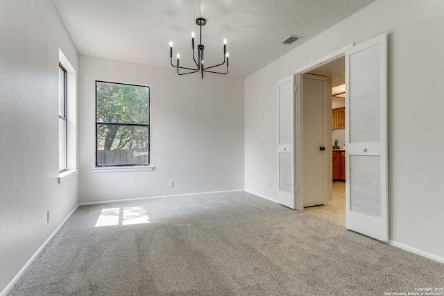 19750 Encino Way, San Antonio, TX 78259 - empty room featuring a chandelier, light colored carpet, and baseboards