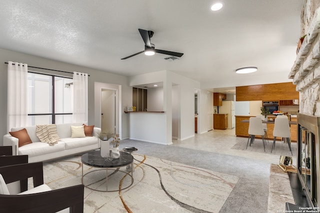 19750 Encino Way, San Antonio, TX 78259 - living area with ceiling fan, light colored carpet, and baseboards