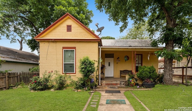 1109 Essex, San Antonio, TX 78210 - view of front facade with fence, a porch, and a front lawn