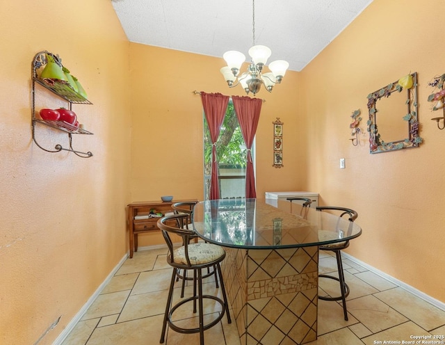 1109 Essex, San Antonio, TX 78210 - dining space featuring light tile patterned floors, baseboards, and an inviting chandelier