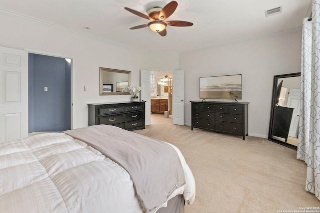 bedroom featuring crown molding, ceiling fan, light colored carpet, ensuite bathroom, and visible vents