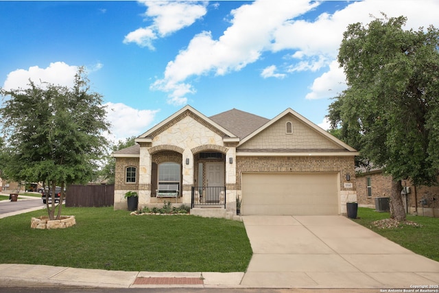 view of front of property with brick siding, a front lawn, concrete driveway, an attached garage, and stone siding