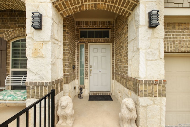 entrance to property with stone siding