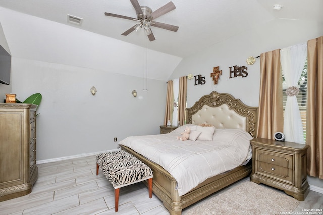 bedroom with baseboards, visible vents, ceiling fan, and lofted ceiling