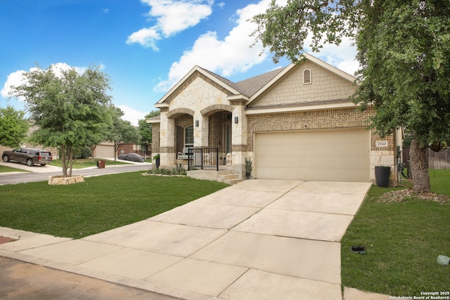 view of front of house featuring stone siding, a front yard, brick siding, concrete driveway, and an attached garage